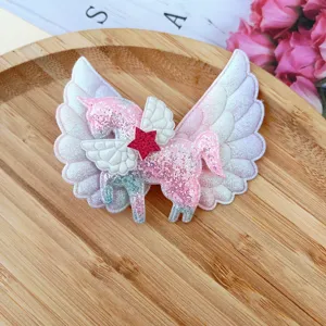 Glitter unicorn angel wings hair clip detail, sparkly pink hair accessory for cute girls daily wear.
