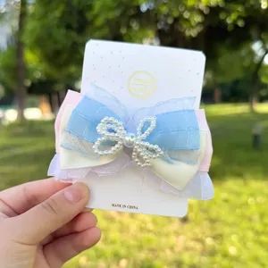 Bonito pasador de pelo con lazo multicapa y perlas, elegante accesorio para el cabello mujer.