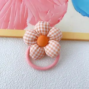 Orange gingham fabric flower hair tie with elastic band, cute daily hair accessory for women.