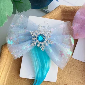 Children blue hair clip bow hair accessory detailed close-up showing rhinestone snowflake design.