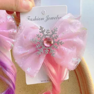 Cute kids pink bow hair clip with sparkly rhinestone snowflake and colorful wig braids for party.