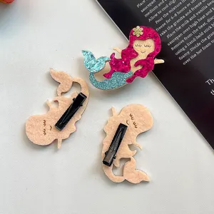 Cute mermaid tail hair clips with glitter design, kids fashion hair accessories detail.