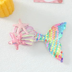 Cute mermaid tail hair clip with pink starfish and colorful sequins for kids fashion.