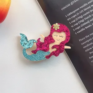 Glitter mermaid tail hair clip detail shot, cute sparkly hair accessory for kids and DIY.