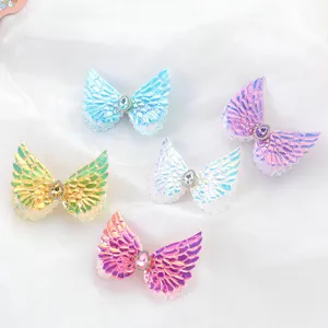 Cute children angel wing hair clips set with sparkling sequins and rhinestone details for kids.