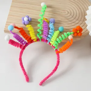 Detailed view of colorful handmade pipe cleaner headband with curly stems and flowers for party.