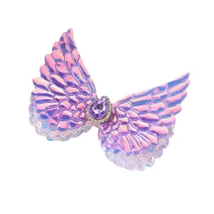 Cute angel wings hair clip for kids, pink iridescent design with sparkly sequins and crystal.