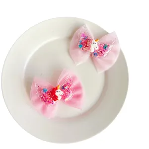 Cute pink mesh bow hair clips for girls, sparkling sequins unicorn and angel wings design.