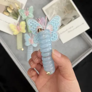 Detailed shot of kids mesh embroidered butterfly telephone wire hair tie, cute elastic ponytail holder.