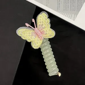 Detailed shot of kids embroidered butterfly phone wire hair tie, cute elastic hair accessory.