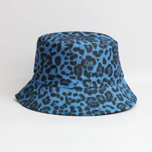 Blue black leopard print bucket hat detail, outdoor sun protection fashion cap close-up.
