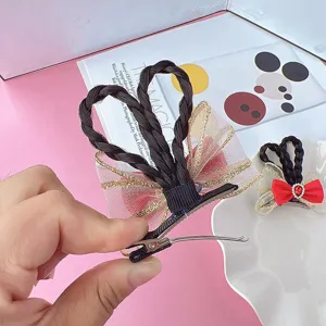 Cute children hair clip with braided bow and sparkling rhinestones for girls and parties.