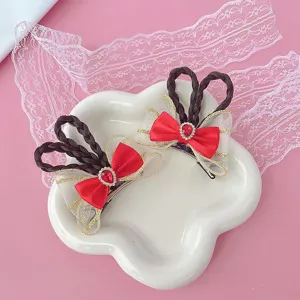 Cute girls hair clip set with red bow braid and sparkling rhinestone crystal details.