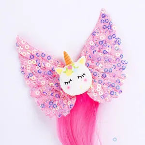 Cute kids cartoon unicorn wing wig hair accessory detail view, vibrant pink sequin design.