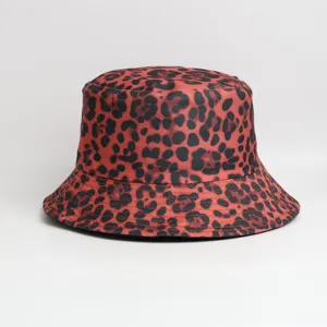 Detailed view showing the premium fabric texture and stylish red leopard print cap item.