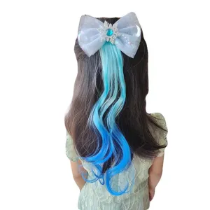 Detailed view of the gradient blue hair extension bow with sparkling snowflake ornament.