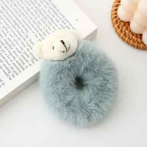 Cute plush teddy bear hair scrunchie detail view, soft blue fuzzy hair tie accessory for women.