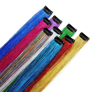 Close-up detail of colorful metallic tinsel hair extensions with secure clip attachment.