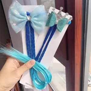 Close-up details of kids wig hair accessories set with blue bow, crown and braided ponytail.