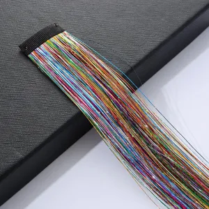Colorful hair tinsel extension sparkle laser hair strands for party styling detail view.