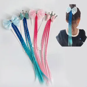 Kids hair extension braids detail showing colorful braids, bows and cute crown accessories.