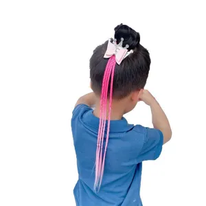 Detailed view of kids hair extension braid with pink crown bow for girls ponytail styling.