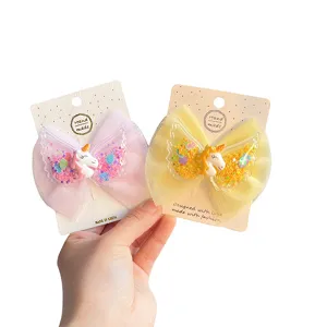 Kids mesh bow hair clips with cute unicorn and angel wings design, sparkly glitter details for girls.