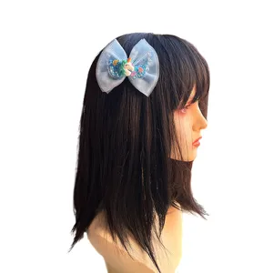 Kids mesh bow hair clip with cute unicorn charm and glitter details, perfect girl hair accessory.