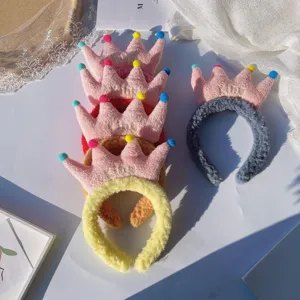 Fluffy plush crown headband with cute colorful pom poms, sweet and stylish hair accessory.