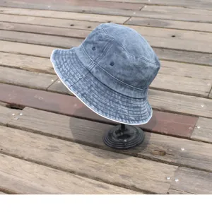 Washed distressed denim bucket hat detail, casual outdoor sun hat for fashion wear.