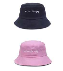Classic cotton bucket hat detail showcasing embroidered lettering in navy blue and pink options.