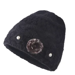Warm winter knitted beanie for elderly women, fleece lined with faux pearl and pompom.