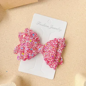 Sparkly pink glitter bow hair clip for girls, cute sparkling hair accessories and sweet side pins.