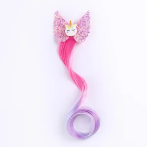 Children cartoon unicorn wing hairpin with colorful gradient hair extension detail view.