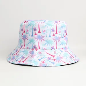 Close-up detail of tropical palm tree print bucket hat fabric, showing vibrant pink and blue.