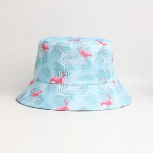 Detailed view of the cute flamingo and palm leaf tropical print on light blue fabric hat.