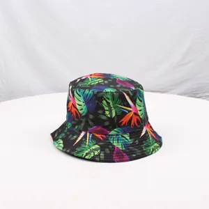 Detail shot of the stylish black printed tropical bucket hat, showing fabric texture.