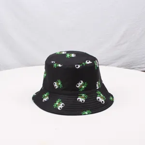 Detailed close-up view of the black printed bucket hat featuring cute cartoon frog pattern.