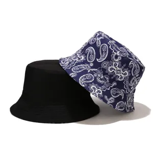 Reversible paisley bucket hat with solid black and blue printed sides for daily street wear.