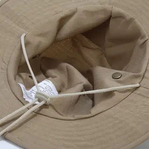 Khaki outdoor jungle hat detail, sun protection fishing cap with adjustable chin cord.