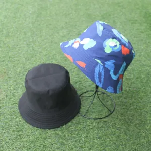 Double-sided bucket hat featuring a solid black side and a colorful printed floral pattern.