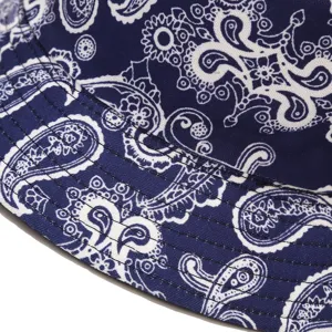 Blue and white paisley pattern bucket hat detail view, classic printed fabric texture.