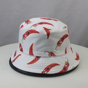 Detail view of white bucket hat featuring cute cartoon red chili pepper print design.