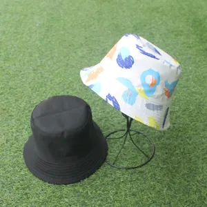 Detailed view of the stylish double-sided bucket hat with colorful abstract print and black.