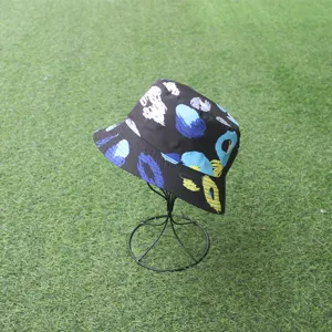 Detailed view of black bucket hat with vibrant abstract art prints for outdoor sunny wear.
