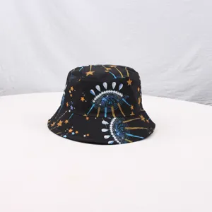 Close-up detail of the black bucket hat featuring a unique cosmic eye and star print pattern.