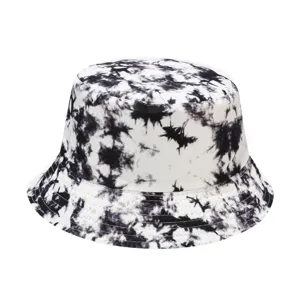 Black and white tie-dye bucket hat detail view, casual outdoor sun protection fabric.