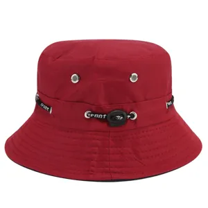 Detail view of red bucket hat with metal eyelets and adjustable sport drawstring.