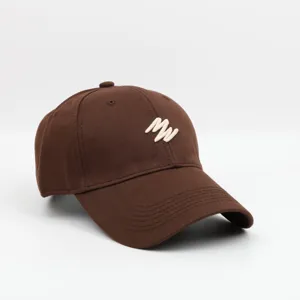 Detailed view of the brown vintage baseball cap featuring cream embroidered letter design for outdoor wear.