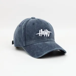 Washed retro distressed baseball cap for women, vintage cotton dad hat with white heart embroidery.
